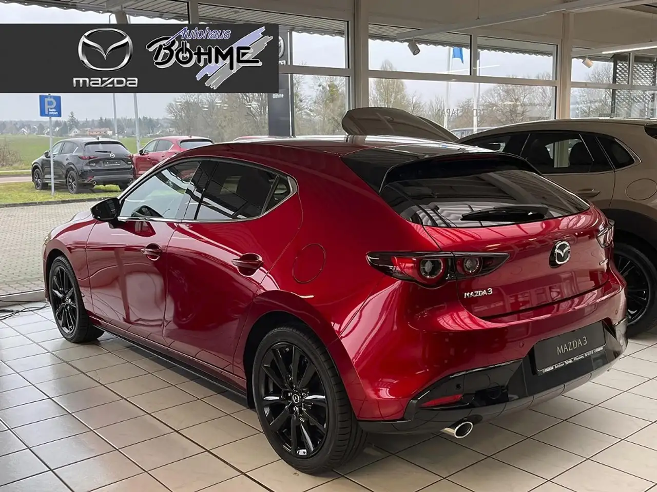 Mazda 3 2.0L e-SKYACTIV G 122PS HOMURA TAGESZUL. — معرض صور السيارة 2